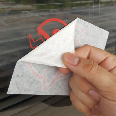 Transfer tape be removed from decal on window